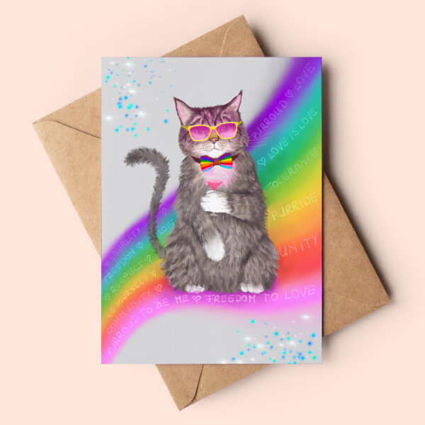 Greeting card featuring a stylish tabby cat sitting on a rainbow wearing a rainbow bow tie and pink, yellow framed glasses. He's sipping a cosmopolitan cocktail. Words like love is love, equality, freedom to love, proud to be me is swirling through the rainbow.