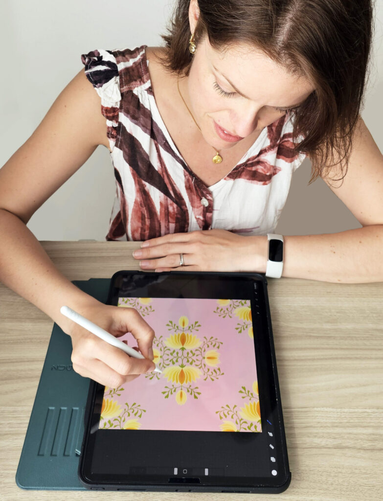 pattern designer drawing floral motifs on an ipad