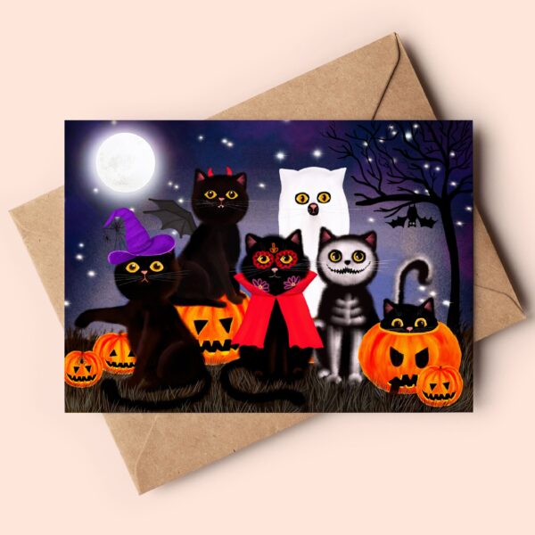 Image showing a spooky halloween greeting card featuring black cats dressed in costumes going trick or treating.